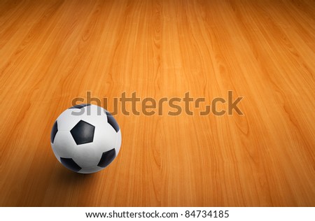 A ball on the wooden floor as background