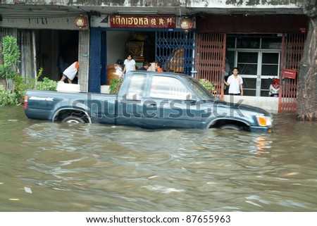 BANGKOK - OCTOBER 28: flooded Bangkok, water covers city streets with 3 ft, car cannot be used, 2 million people are effected on Oct. 28, 2011. Flooding is all around Bangkok.