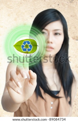 Portrait of Asian girl press recycle button, creative concept of ecological