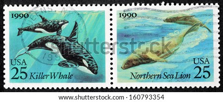 UNITED STATES - CIRCA 1990: a set of two stamps printed by USA shows images of Killer Whale and Northern Sea Lion, circa 1990.