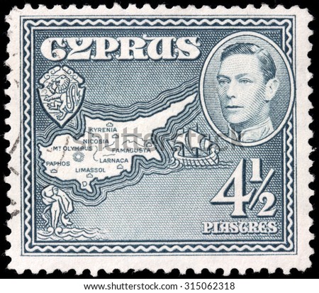 CYPRUS - AUGUST 10, 2015: A stamp printed by CYPRUS shows image portrait of King George VI against view of Cyprus Map and Coat of Arms, circa May, 1938.