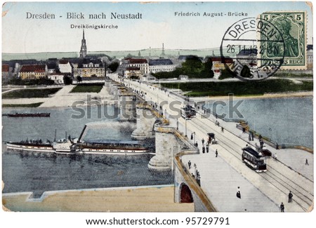GERMANY - CIRCA 1913: A stamps printed by GERMANY shows women in ancient armor. Stamp is on the old  postcard shows view of  Friedrich August Bridge in Dresden, circa 1913.
