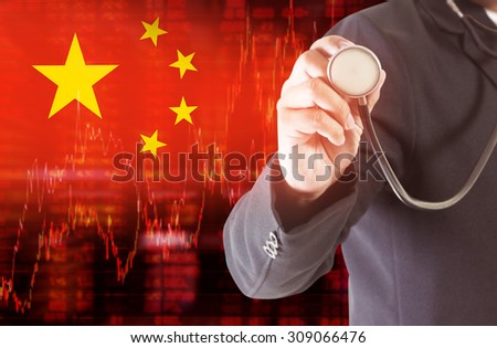 Flag of China. Downtrend stock data diagram with Businessman hand holding a stethoscope analyze solution ideas concept design