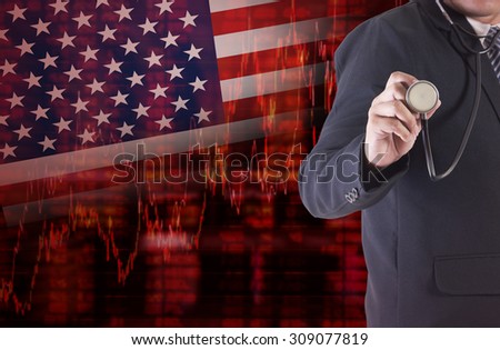 Crisis in USA - Shares Fall Graph on United States of America Flag with Businessman hand holding a stethoscope analyze solution ideas concept design
