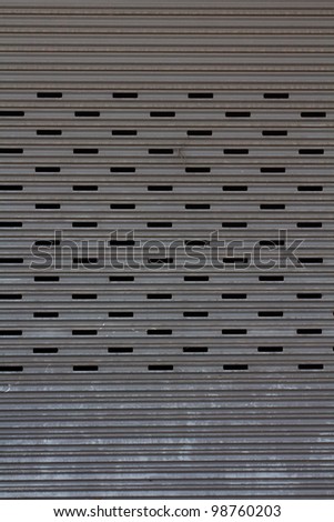 metal garage door gate store roller shutter. closeup Useful as background for design-works