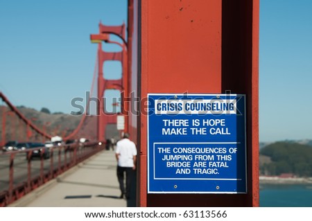 A sign on Golden Gate Bridge detailing Crisis Counseling, the sign reads Â?Â?There is hope make the call. The consequences of jumping from this bridge are fatal and tragic