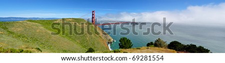 Golden Gate Bridge Panorama from park with fog rolling in from the Pacific Ocean