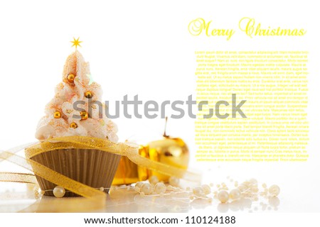 Christmas cupcake and christmas decoration on white background