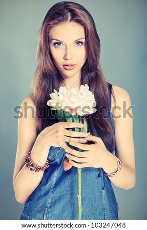 Shot of a beautiful girl in summer style posing at studio.
