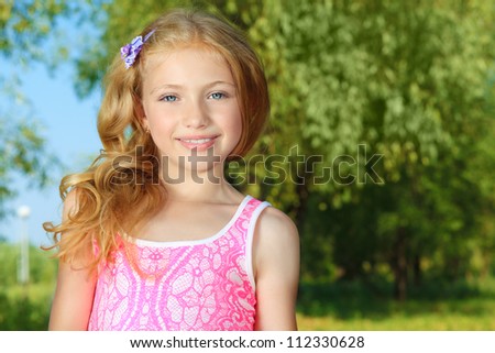 Portrait of a cute smiling girl outdoor.