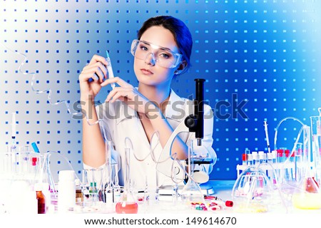 Employee of the laboratory in the working process. Laboratory equipment.
