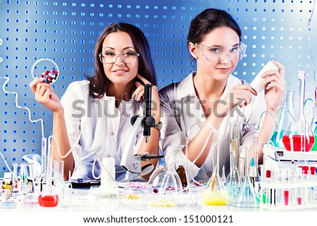 Laboratory staff demonstrating drugs. Laboratory equipment.
