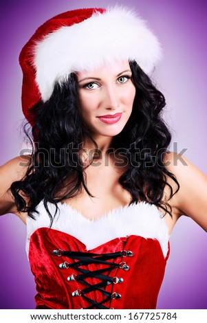 Portrait of a charming smiling young woman in Christmas costume.