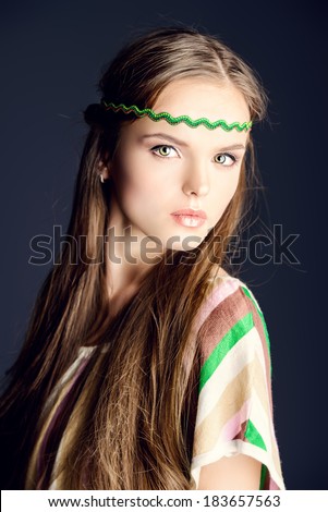 Beautiful girl with natural make-up and long hair. Hippie style.