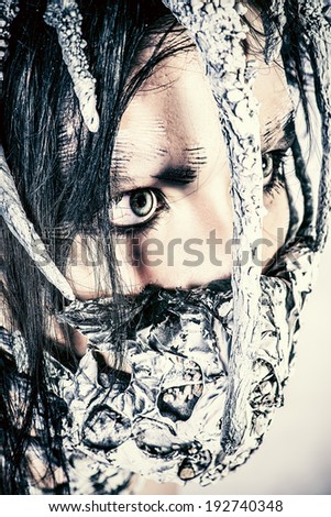 Close-up portrait of a mythical creature male. Alien creature. Horror. Halloween. Isolated over white.