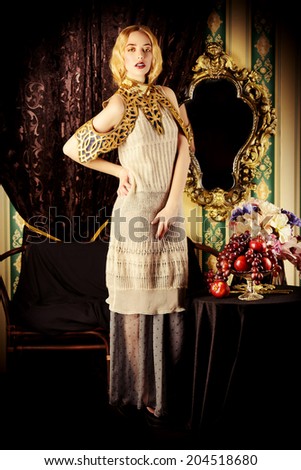 Beautiful fashion model in a rich historical dress. Vintage. Luxury style.