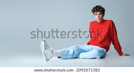 Similar – Image, Stock Photo Stylish man sitting at airport with suitcase and laptop, working, typing, browsing. Businessman traveling.