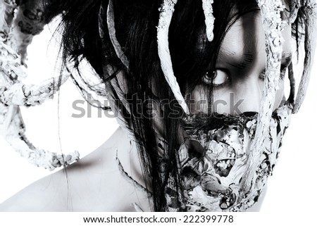 Close-up portrait of a mythical creature male. Alien creature. Horror. Halloween. Isolated over white. Black-and-white.
