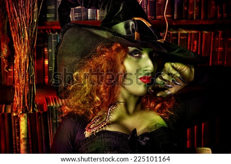 Close-up portrait of a fairy wicked witch in the wizarding lair. Magic. Halloween.