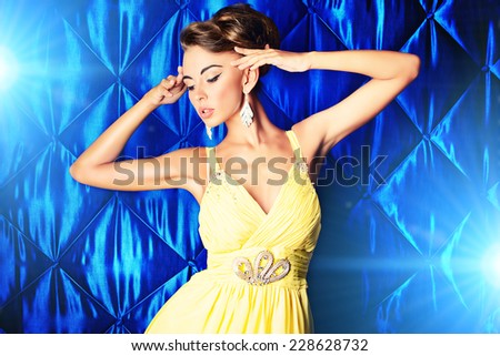 Portrait of a magnificent young woman in evening dress. Fashion shot.