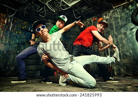 Modern dancers dancing in the garage. Urban lifestyle. Hip-hop generation.