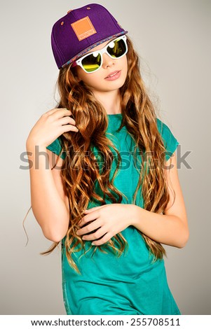 Portrait of a trendy teen girl. Fashion, lifestyle. Studio shot.