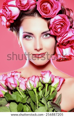 Beautiful tender girl with floral hairstyle. Roses. Cosmetics. Beauty, fashion. Spring and summer.