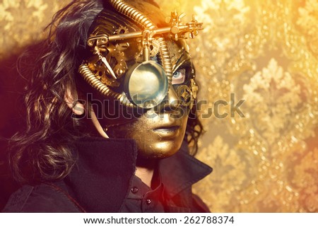 Steampunk man wearing mask with various mechanical devices.  Fantasy.