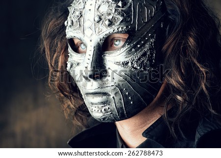 Portrait of a mysterious man in iron mask. Steampunk. Fantasy. Halloween.
