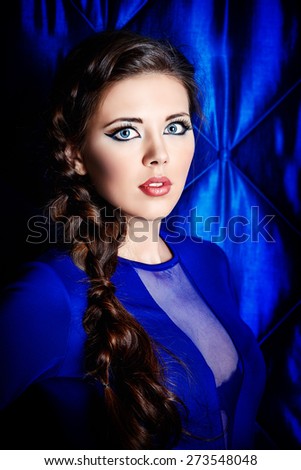 Portrait of young woman with beautiful big eyes. Make-up, cosmetics.