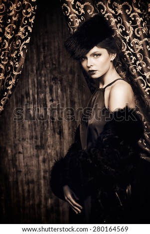 Beautiful young woman posing in fur. Luxury. Vintage style. Beauty, fashion.