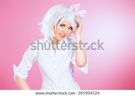 Close-up portrait of a lovely girl wearing white wig and white blouse posing over pink background. Anime style.