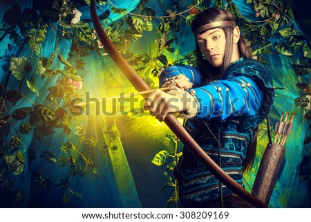 Portrait of a male elf with a bow and arrows in a magical forest.