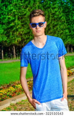 Handsome guy wearing sunglasses outdoor. Vacation day. Men\'s beauty, fashion.