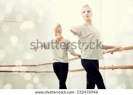 Similar – Foto Bild Ballerina-Tänzerin beim Aufwärmen des flexiblen Körpers im sonnigen Studio.