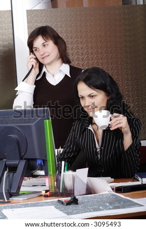 Group of 2 business people working together in the office.