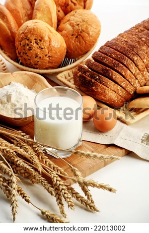 Baking ingredients, milk, and pastry isolated on white background