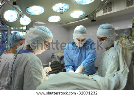 Medical theme: surgeons in operative room.