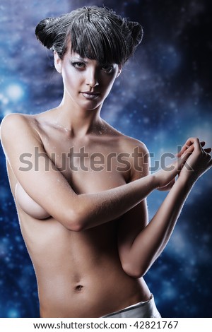 Portrait of a snow female model over sky of stars and snow. Fashion, beauty.