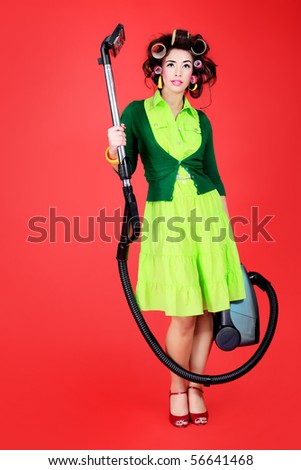 Shot of a funny  woman housewife dressed in retro style.