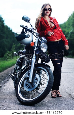 Shot Of An Attractive Woman Biker Posing On Her Motorcycle. Stock Photo ...