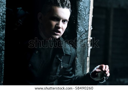 Shot of a scary man with bloody hands,  gothic style. Halloween, horror.