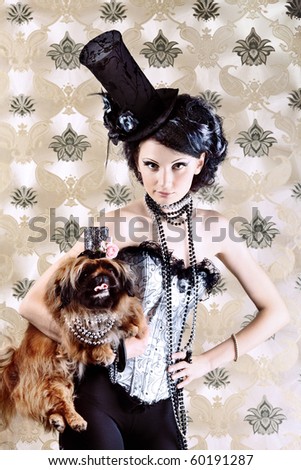 Portrait of a fashionable lady with a dog over vintage background.