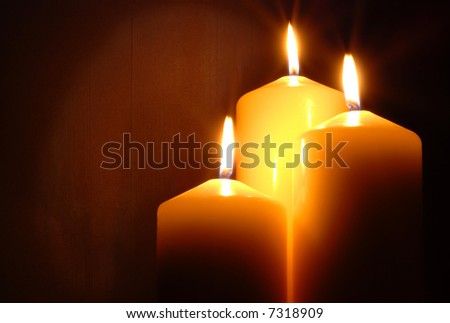 attractive candles on wood grain oak background