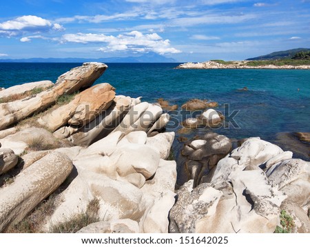 Paradise bay beach , untouched nature abstract archipelago in seashore with rocks in water in peninsula Halkidiki , Greece