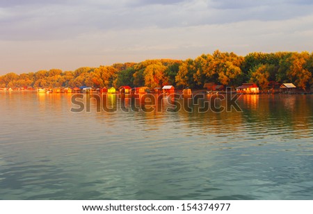 sunset and water house in river Sava, Belgrade, Serbia