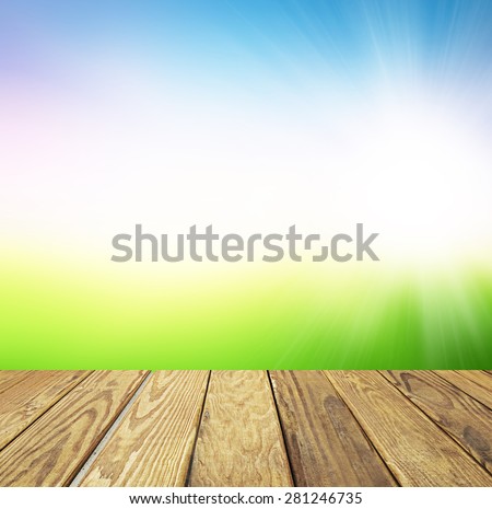 Empty wood table over blurred landscape with bokeh background, product display template,deck,sky