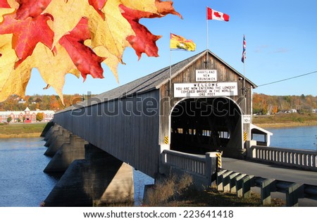 The longest wooden covered bridge in the world located in Hartland, New Brunwick, Canada in Autumn time with colorful maple leaves