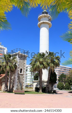 Lighthouse along the promenade at Torre del Mar with palm tree leaf border on the Costa Del Sol, Andalucia, Spain