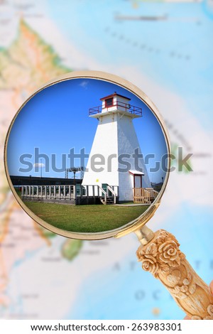 Looking in on a lighthouse in Atlantic Canada with blurred map in the background